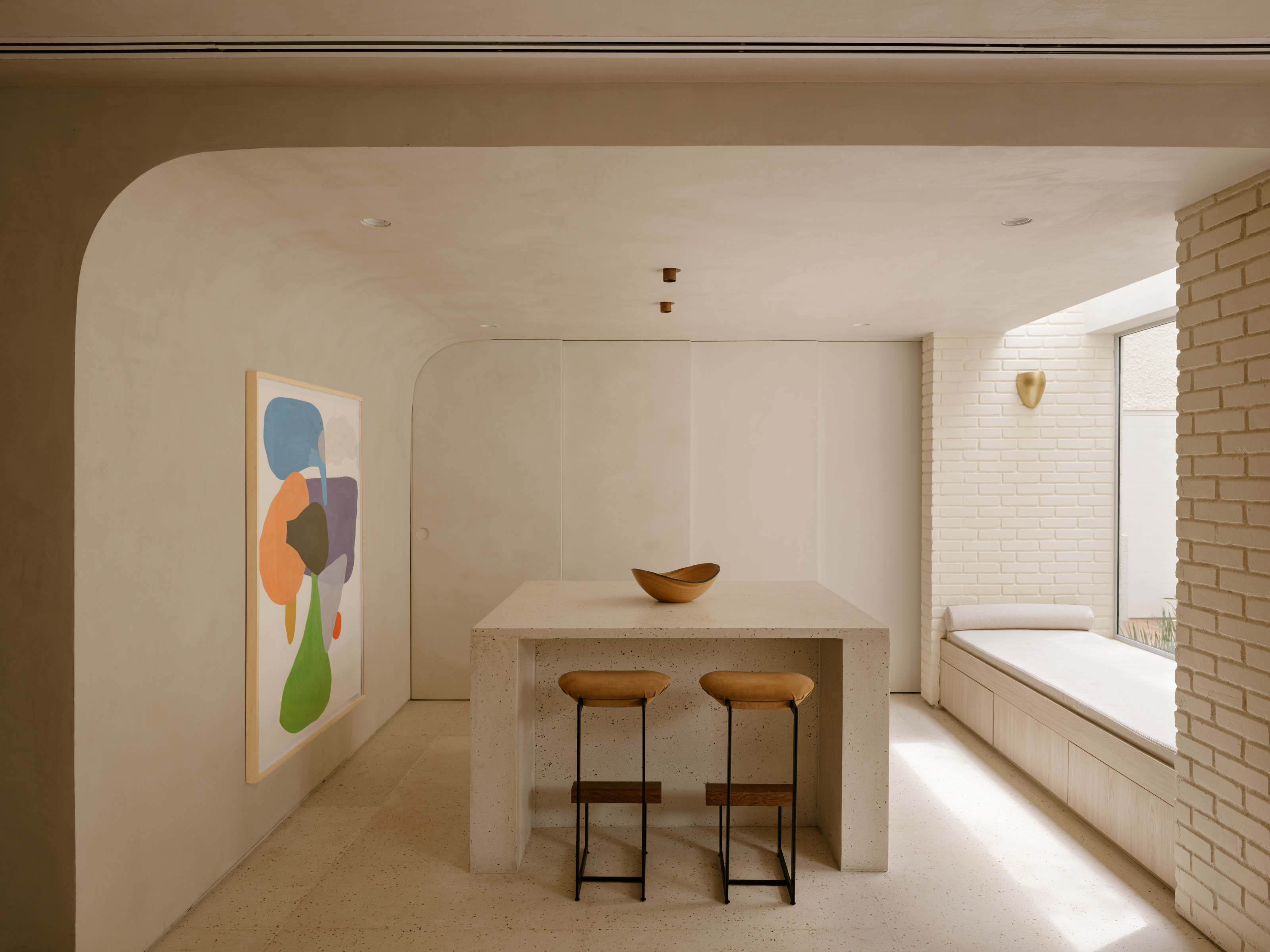A sliding door closes off the main cooking area from the dining spaces