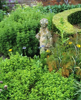 herb garden focal point of statue