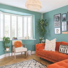 Bay window with shutters in colourful living room