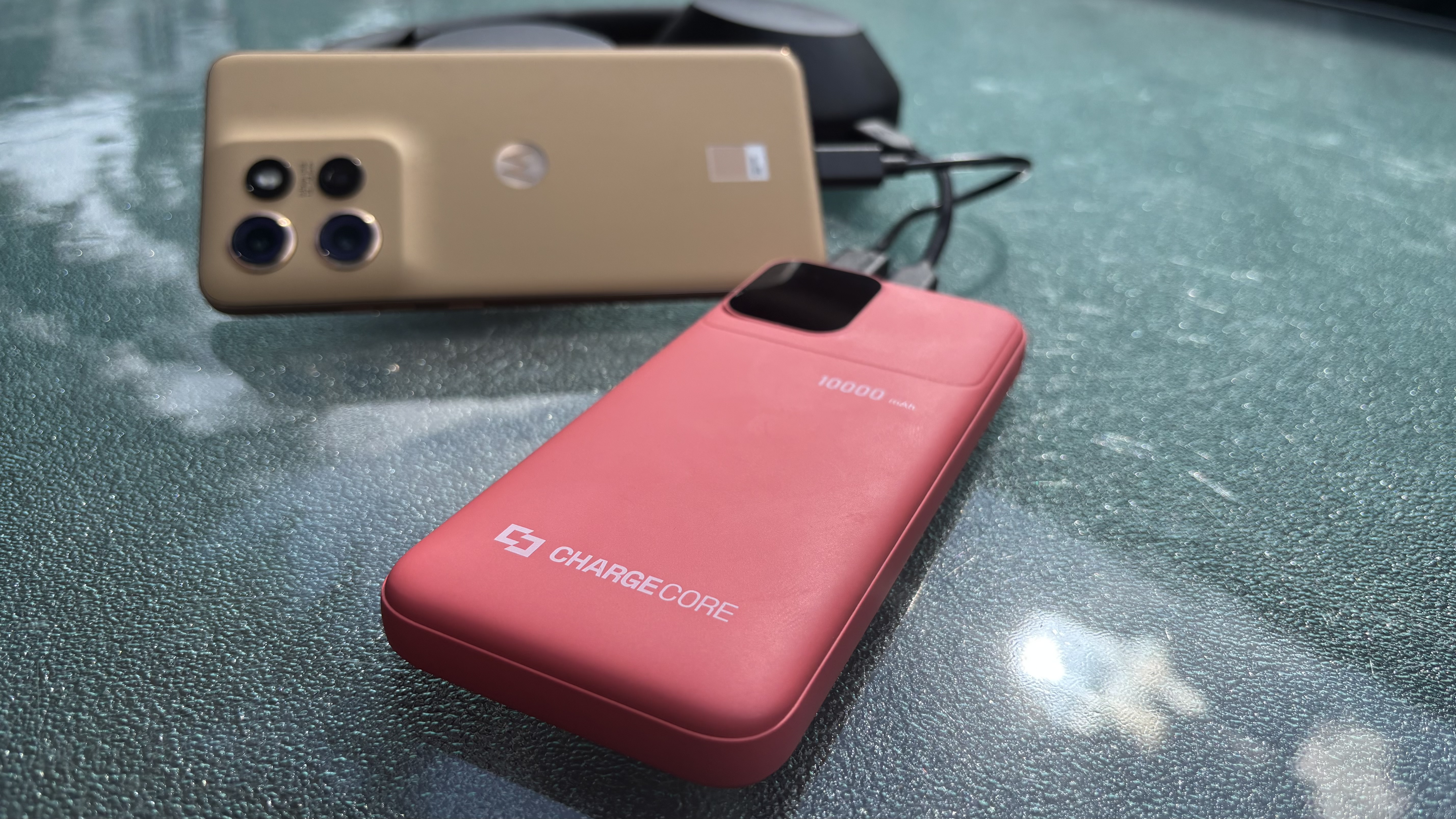 Laser ChargeCore SafeCharge Max 10K powerbank charging headphones and a phone
