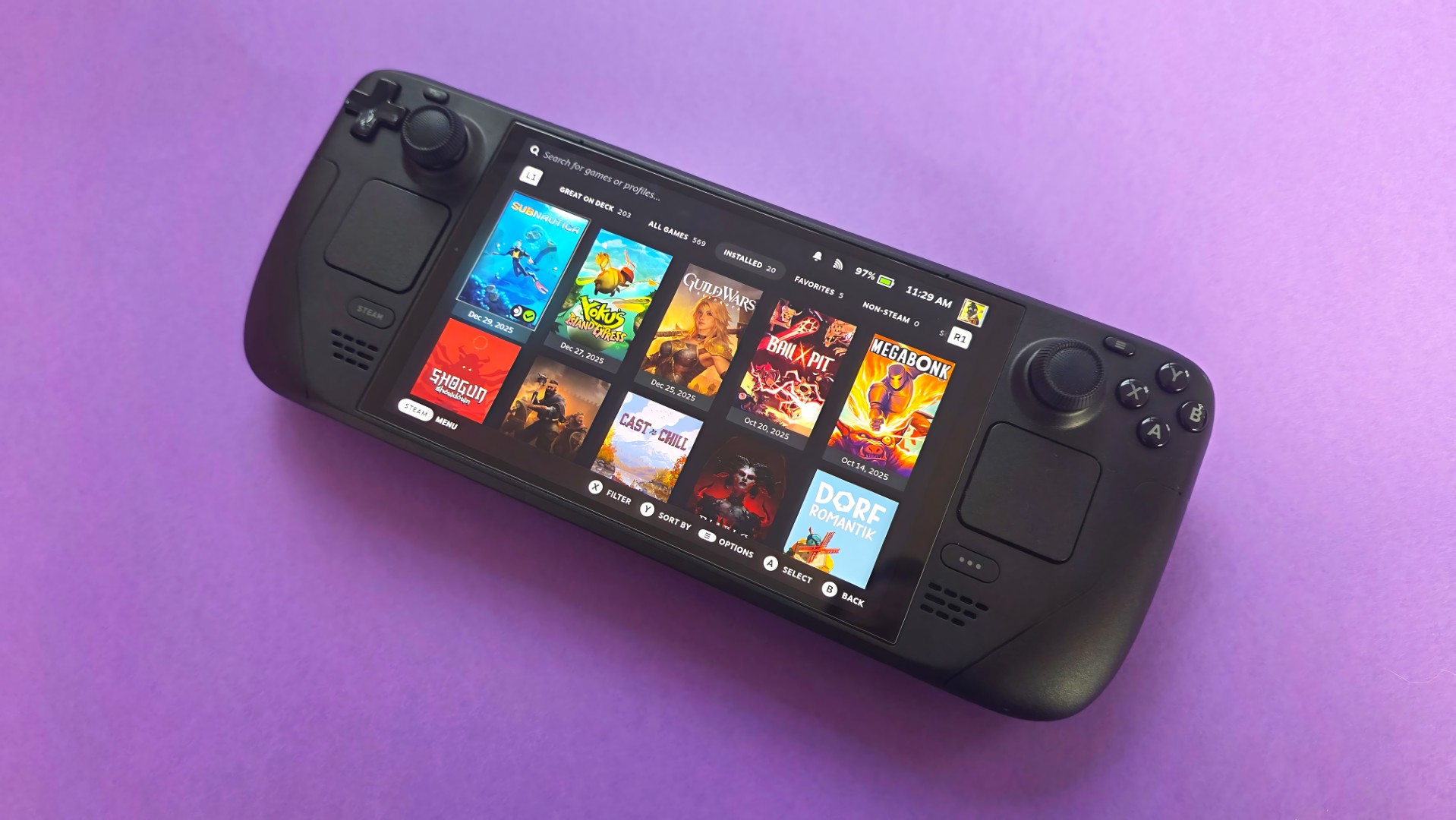 A Steam Deck OLED handheld gaming console on a solid purple background