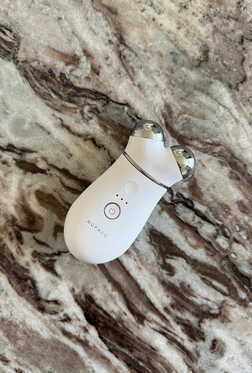 The NuFace Trinity device on a marbled background