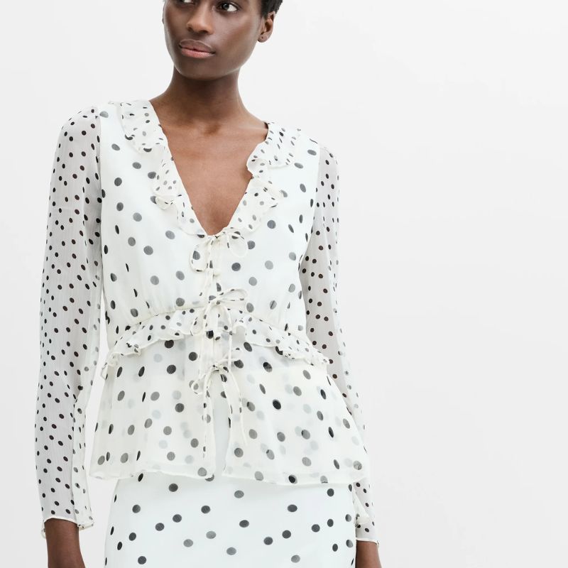 Polka dot two piece top and skirt outfit on a model