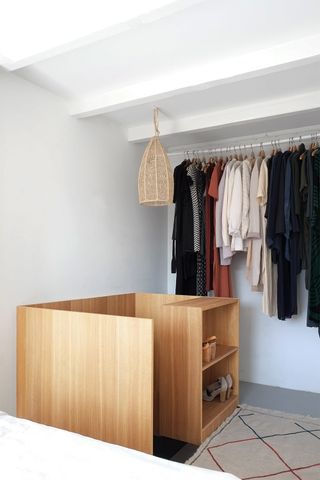 An attic with storage for clothes
