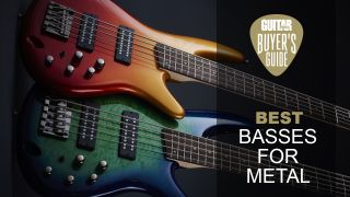 Two Ibanez metal basses lying on a dark floor