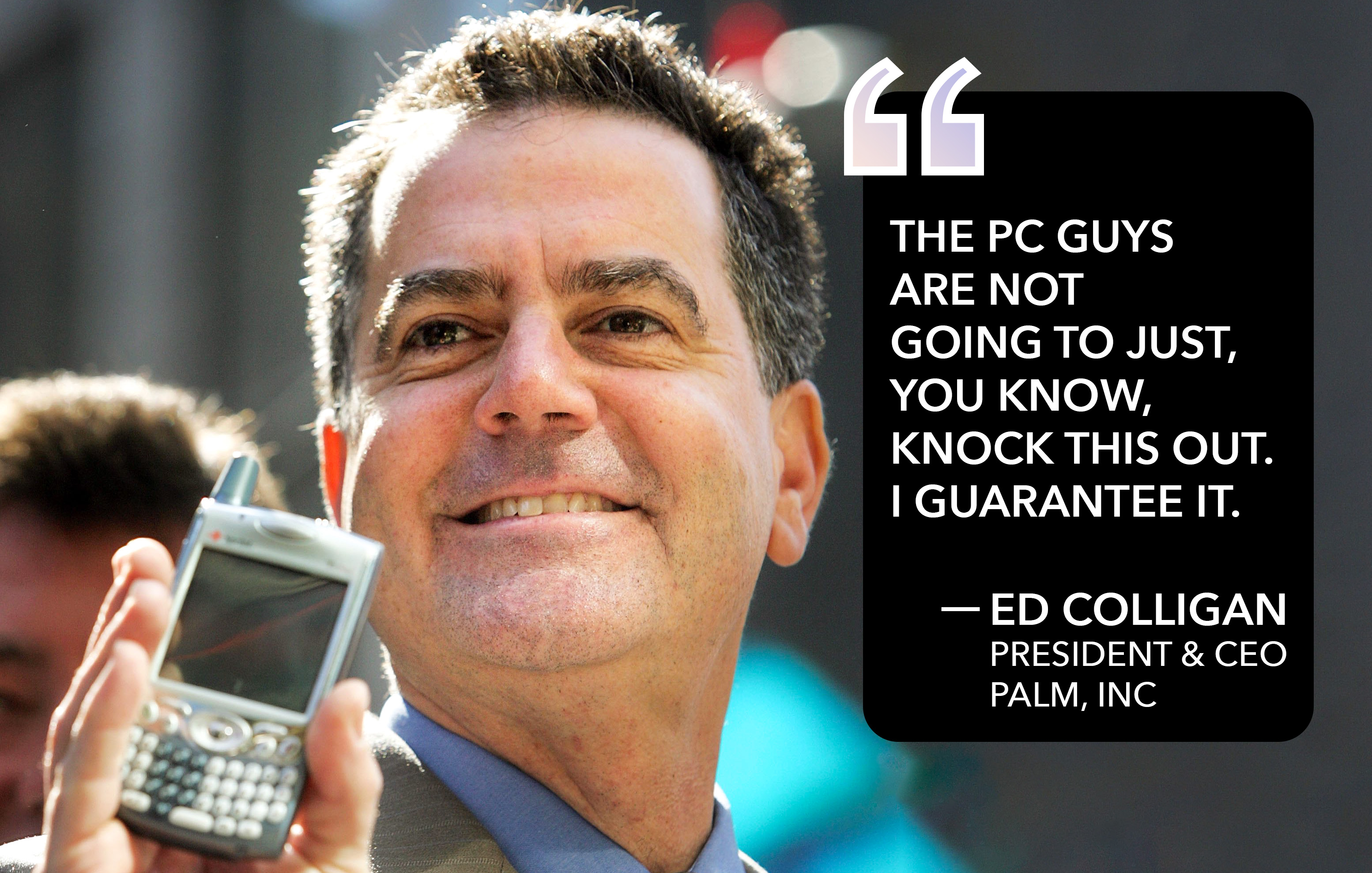 Ed Colligan, president and CEO of Palm, Inc., holds a Palm Treo in 2006