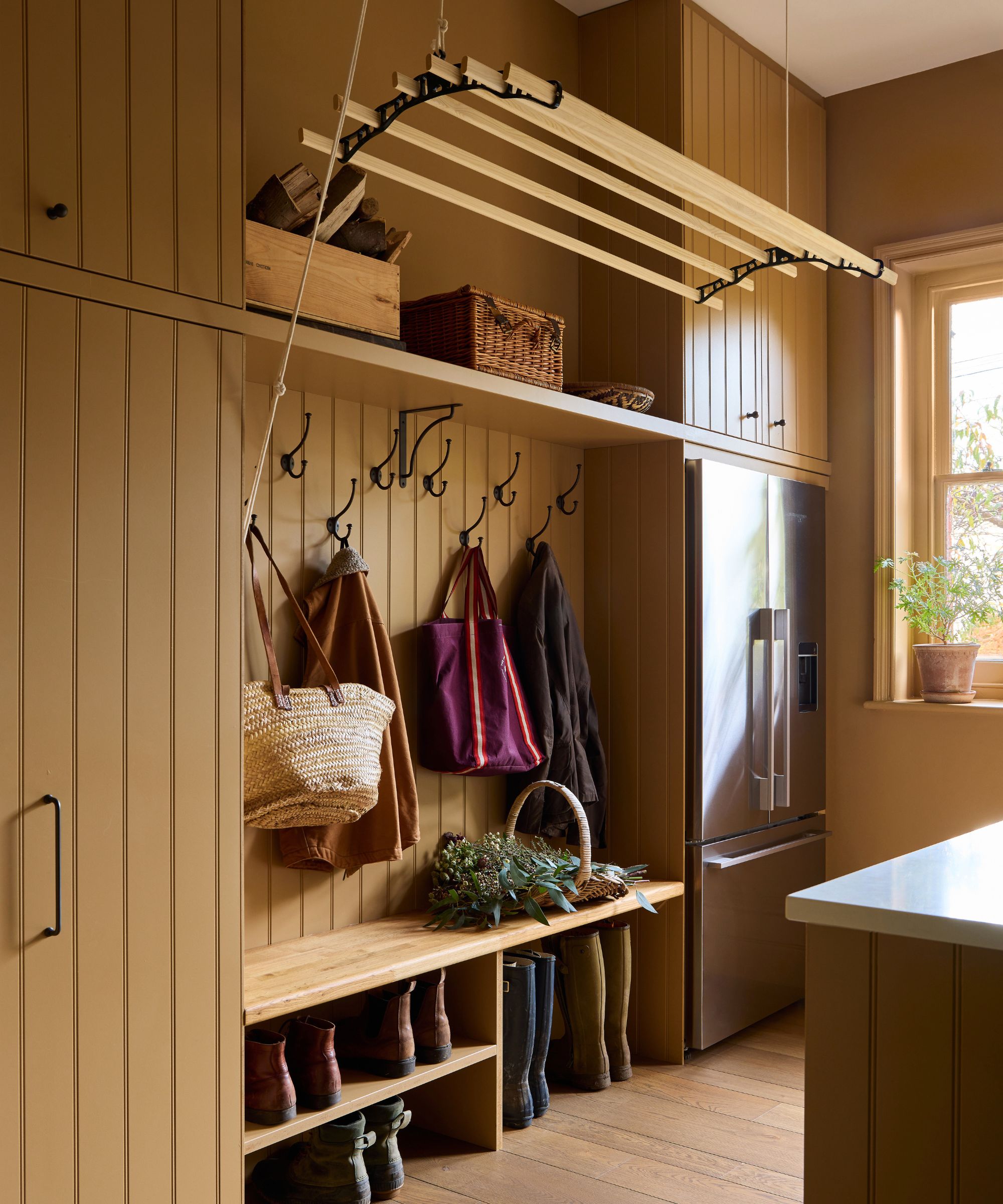 Laundry and bootroom with a sheila maid painted in Caddie by Paint &amp;amp; Paper Library