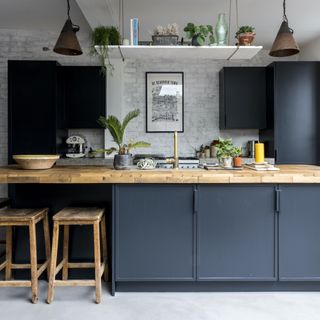 black kitchen with wooden worktops
