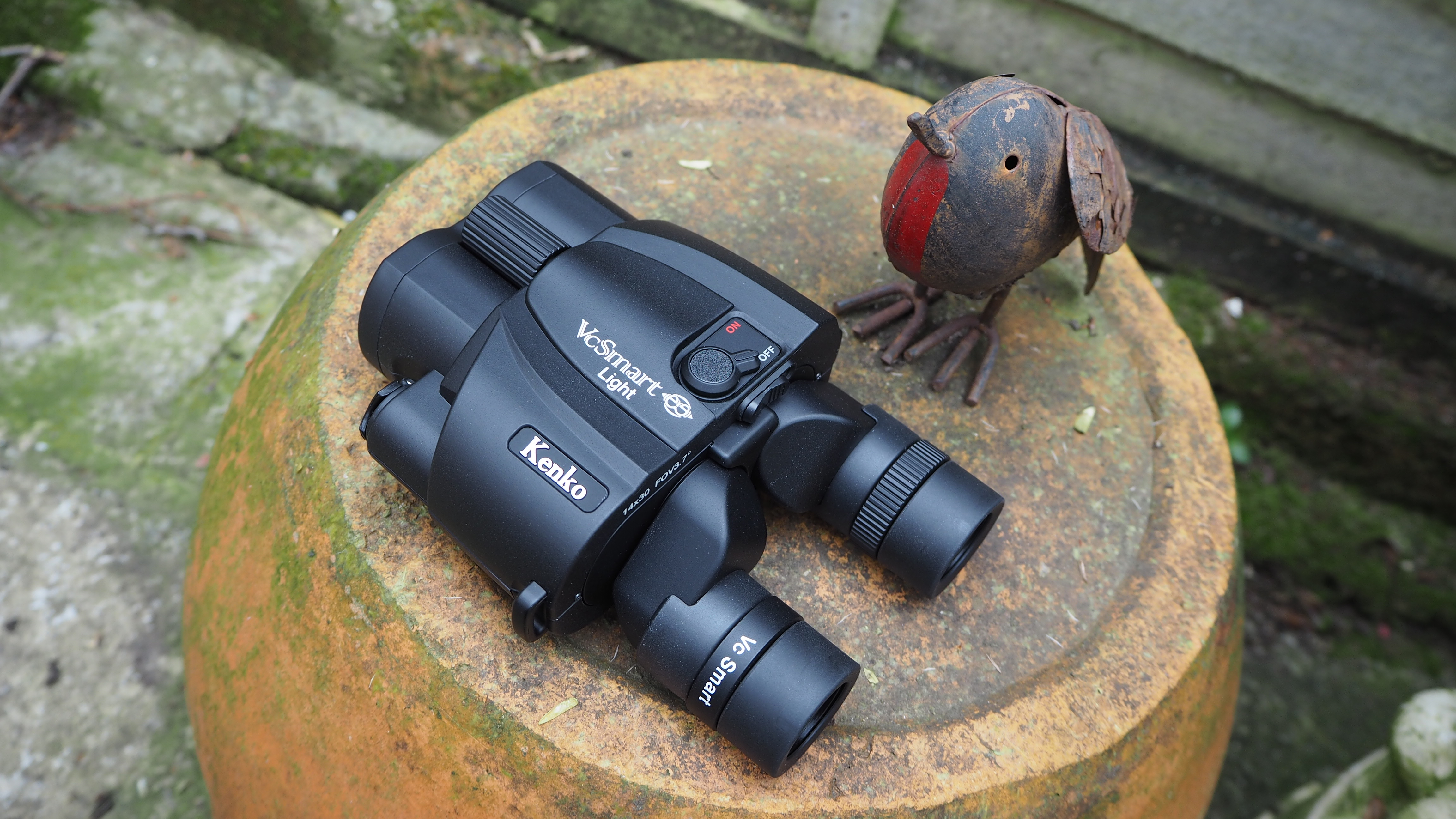 Kenko Vc Smart 14x30 Light binoculars on a plant pot