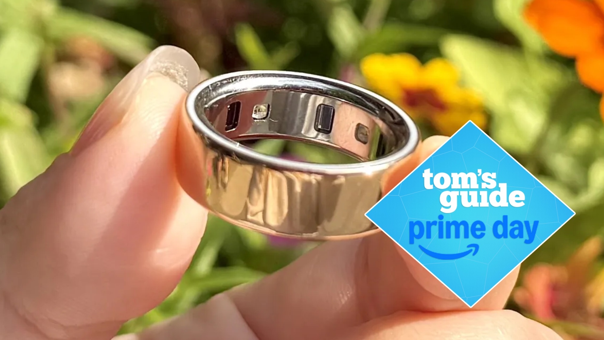 An Oura Ring 4 with a Tom's Guide Prime Day logo next to it