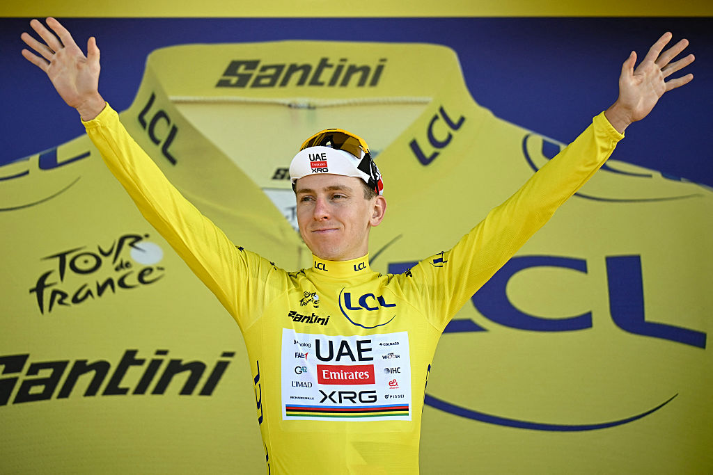 UAE Team Emirates - XRG's Slovenian rider Tadej Pogacar celebrates on the podium with the overall leader's yellow jersey after the 16th stage of the 113th edition of the Tour de France cycling race, 26 km between &amp;Eacute;vian-les-Bains and Thonon-les-Bains in the French Alps, on July 21, 2026. (Photo by Loic VENANCE / AFP)