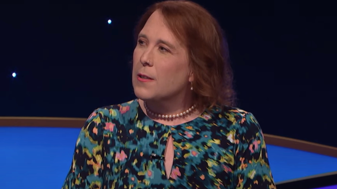 Amy Schneider turns her head during a conversation onstage at Jeopardy! Masters.