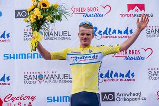 Tyler Stites celebrates the overall win at 2024 Redlands Bicycle Classic, his third GC title at the California race