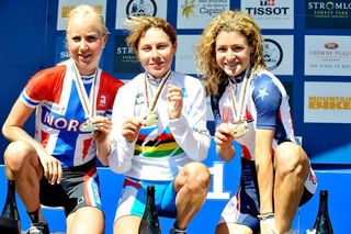 Irina Kalentieva (Russia), centre, with gold and the rainbow jersey of XC World Champ