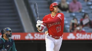 Shohei Ohtani #17 of the Los Angeles Angels, seen here hitting an RBI triple, is the defending MVP going into the new season of MLB live streams