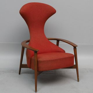 Red high backed chair with wooden arms