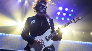 Jim Root plays live on stage with Slipknot