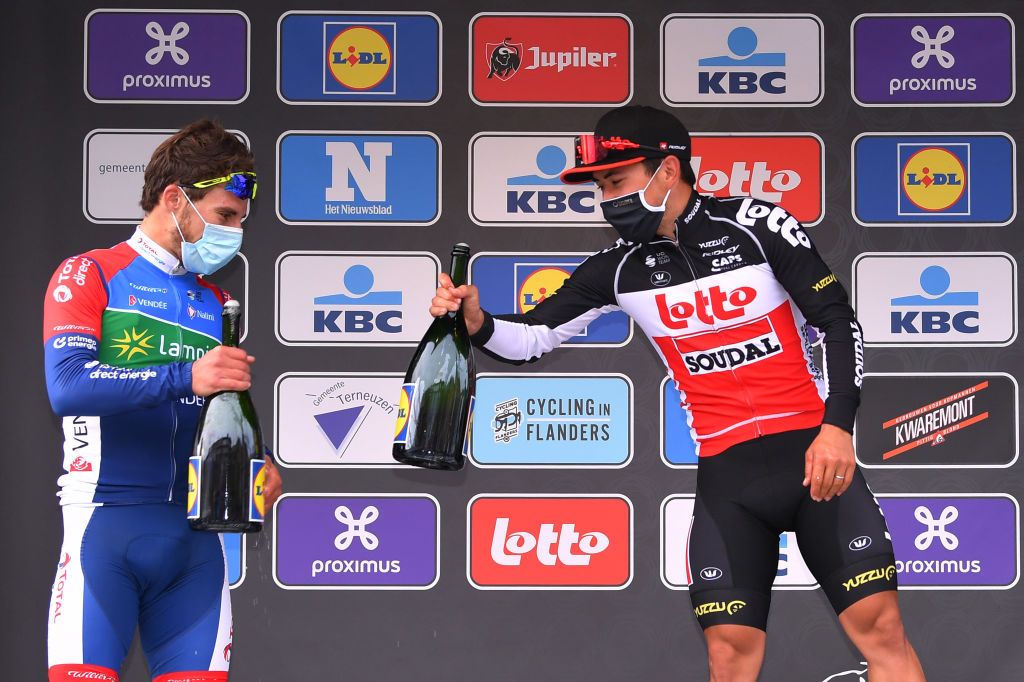 SCHOTEN BELGIUM OCTOBER 14 Podium Niccolo Bonifazio of Italy and Team Total Direct Energie Caleb Ewan of Australia and Team Lotto Soudal Celebration Champagne Mask Covid safety measures during the 108th Scheldeprijs 2020 a 1733km stage from Schoten to Schoten Scheldeprijs FlandersClassic SP20 on October 14 2020 in Schoten Belgium Photo by Luc ClaessenGetty Images