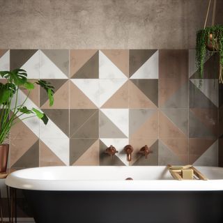 bathroom with bathtub and tiles wall