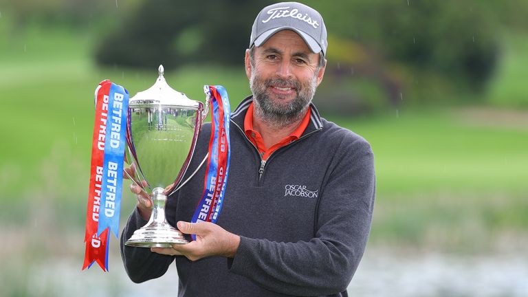 Richard Bland poses with the trophy after winning the 2021 British Masters