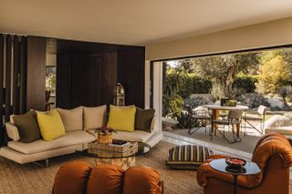 rancho mirage house showcasing low lying, modernist architecture with lots of desert planting and outdoor areas