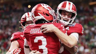 The Indiana Hoosiers' Fernando Mendoza celebrating with Omar Cooper Jr. ahead of the College Football Playoffs National Championship game