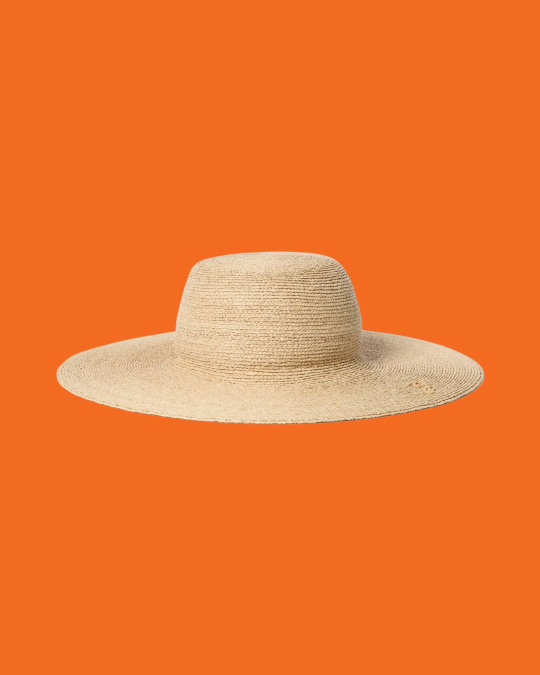 The Sole Hat against orange background.