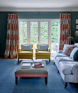 colourful interior dining area with sofa ottoman and chairs