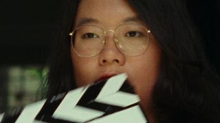 Sandi Tan with a clapperboard as seen in Shirkers