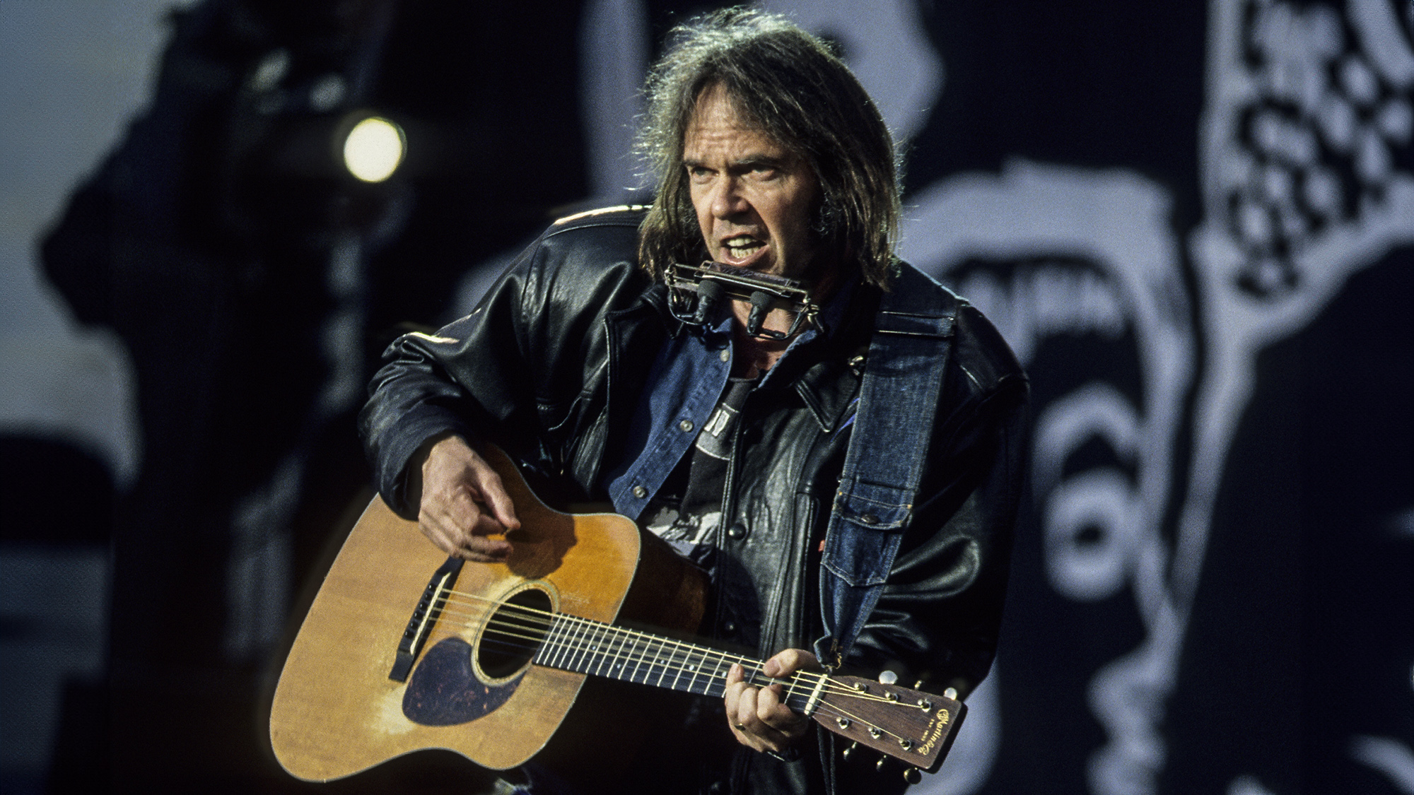 Singer Neil Young performs at a concert held to celebrate the release of African National Congress (ANC) leader Nelson Mandela from prison, Wembley Stadium, London, 16th April 1990.