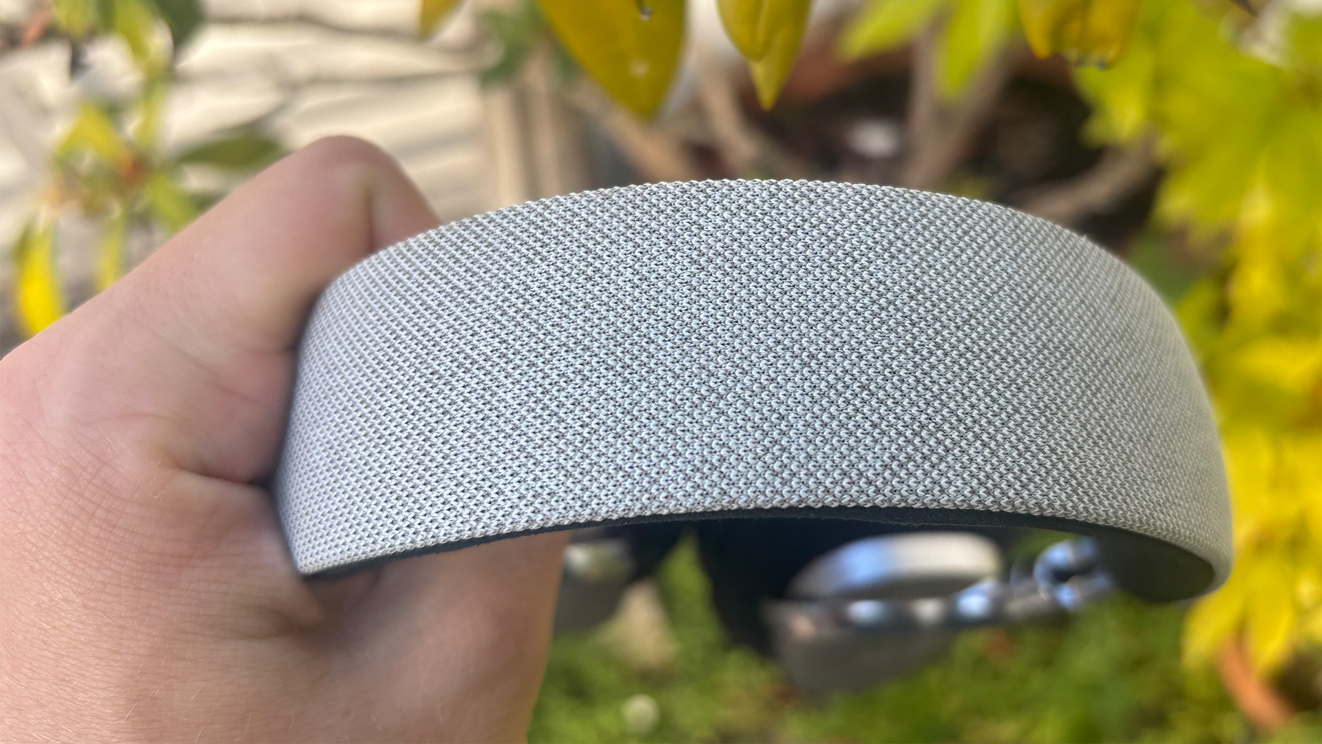 Noble Fokus Artemis over-ear headphones held in hand detail of headband