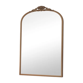 gold framed mirror with crown detailing