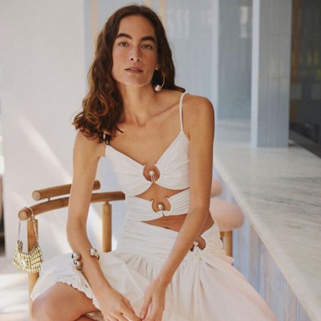 Woman wearing Mytheresa white greek inspired outfit by bar