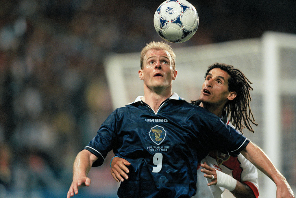 Scotland's Gordon Durie (L) and Morocco's Smahi Triki during the 1998 soccer World Cup. | Location: St.-Etienne, France.