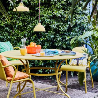 garden with round table and yellow chair