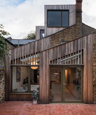 A pitched roof kitchen extension with contemporary timber cladding effect