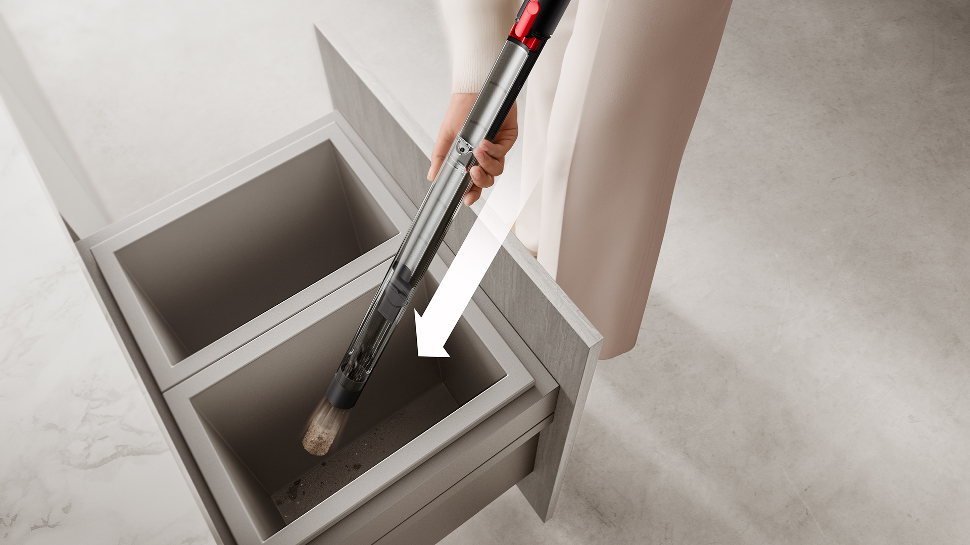 Dyson PencilVac vacuum being emptied