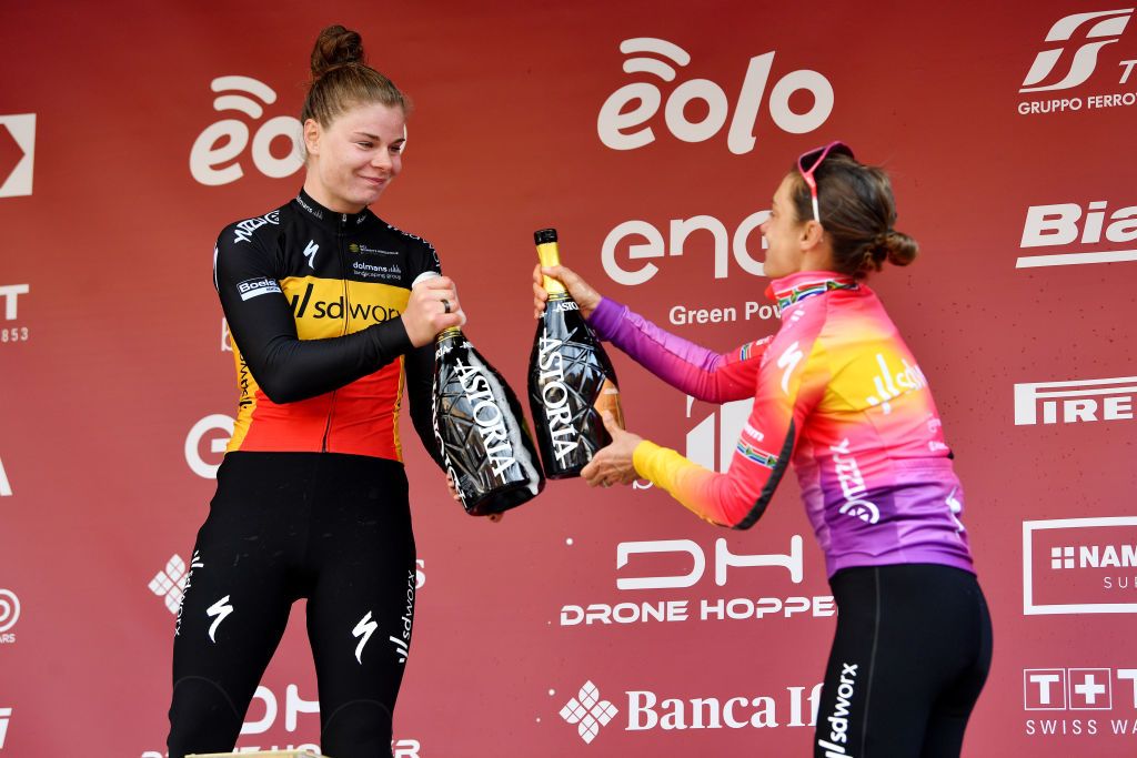 SIENA ITALY MARCH 05 LR Race winner Lotte Kopecky of Belgium and Team SD Worx and Ashleigh Moolman Pasio of South Africa and Team SD Worx on third place celebrate on the podium during the podium ceremony after the Eroica 8th Strade Bianche 2022 Womens Elite a 136km one day race from Siena to Siena Piazza del Campo 321m StradeBianche on March 05 2022 in Siena Italy Photo by Luc ClaessenGetty Images