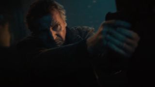 Liam Neeson holding gun in Blacklight