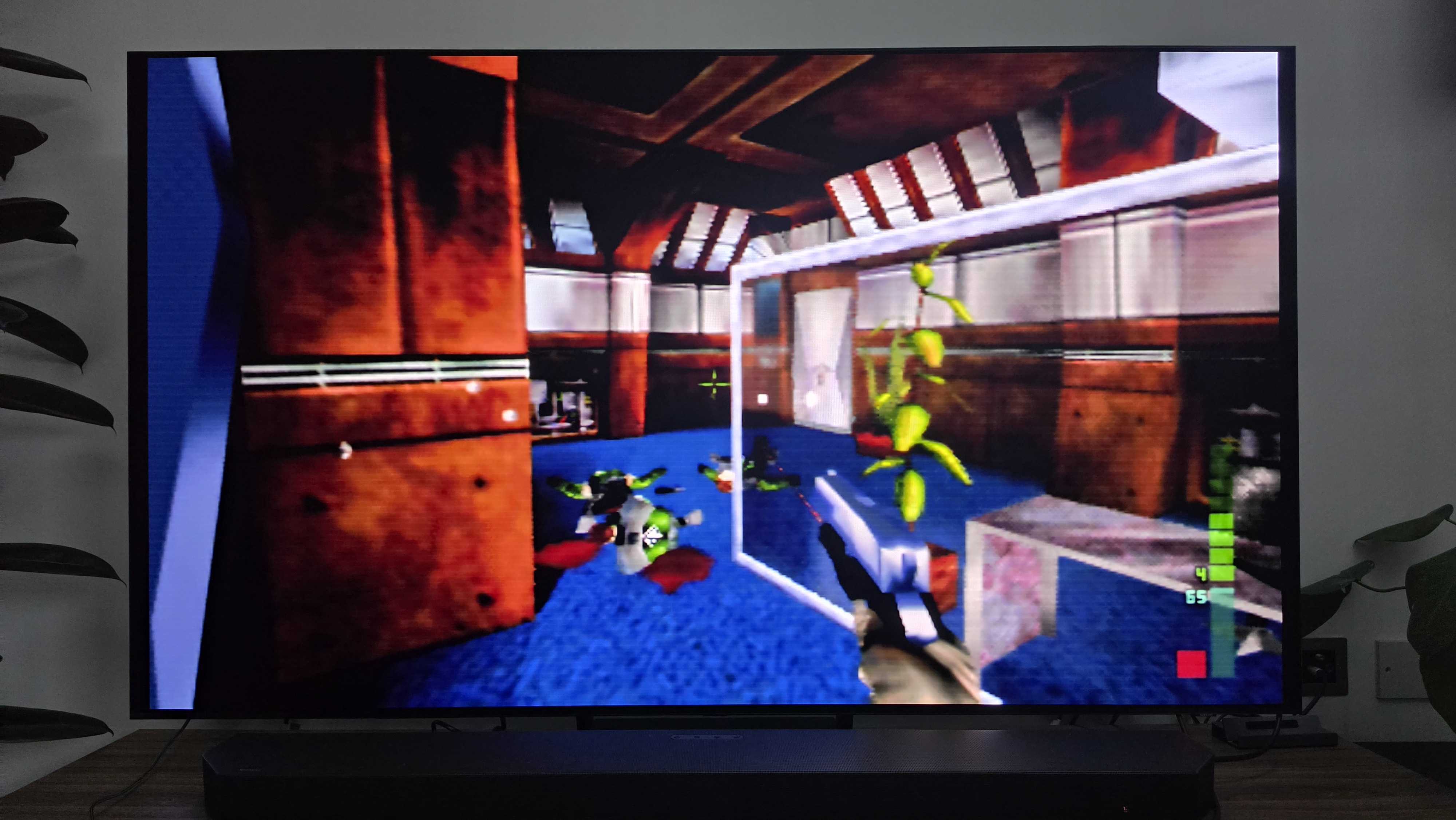 A TV showing Perfect Dark running on the M64