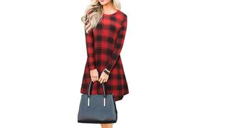 A plaid red and white jumper dress on a blonde model.