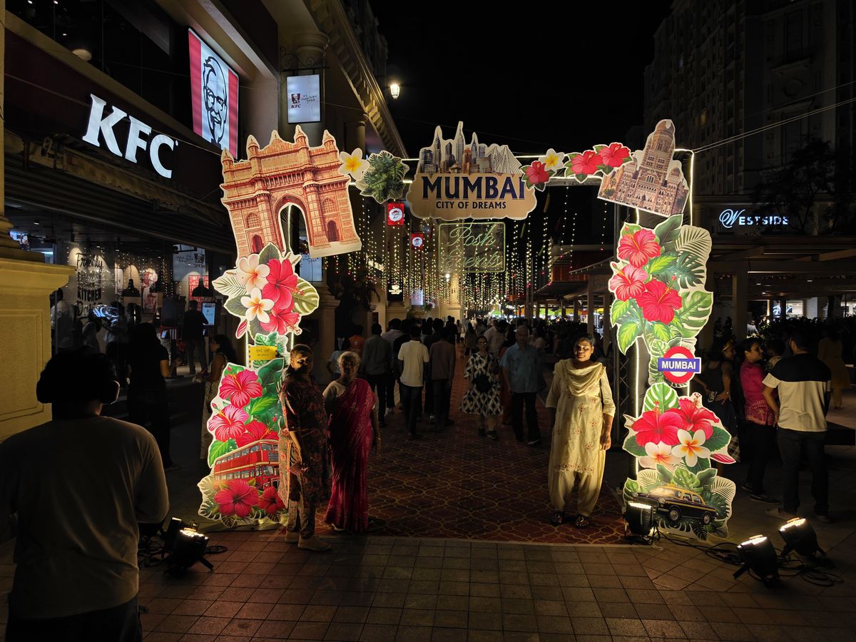 A Mumbai festival entrance at night.
