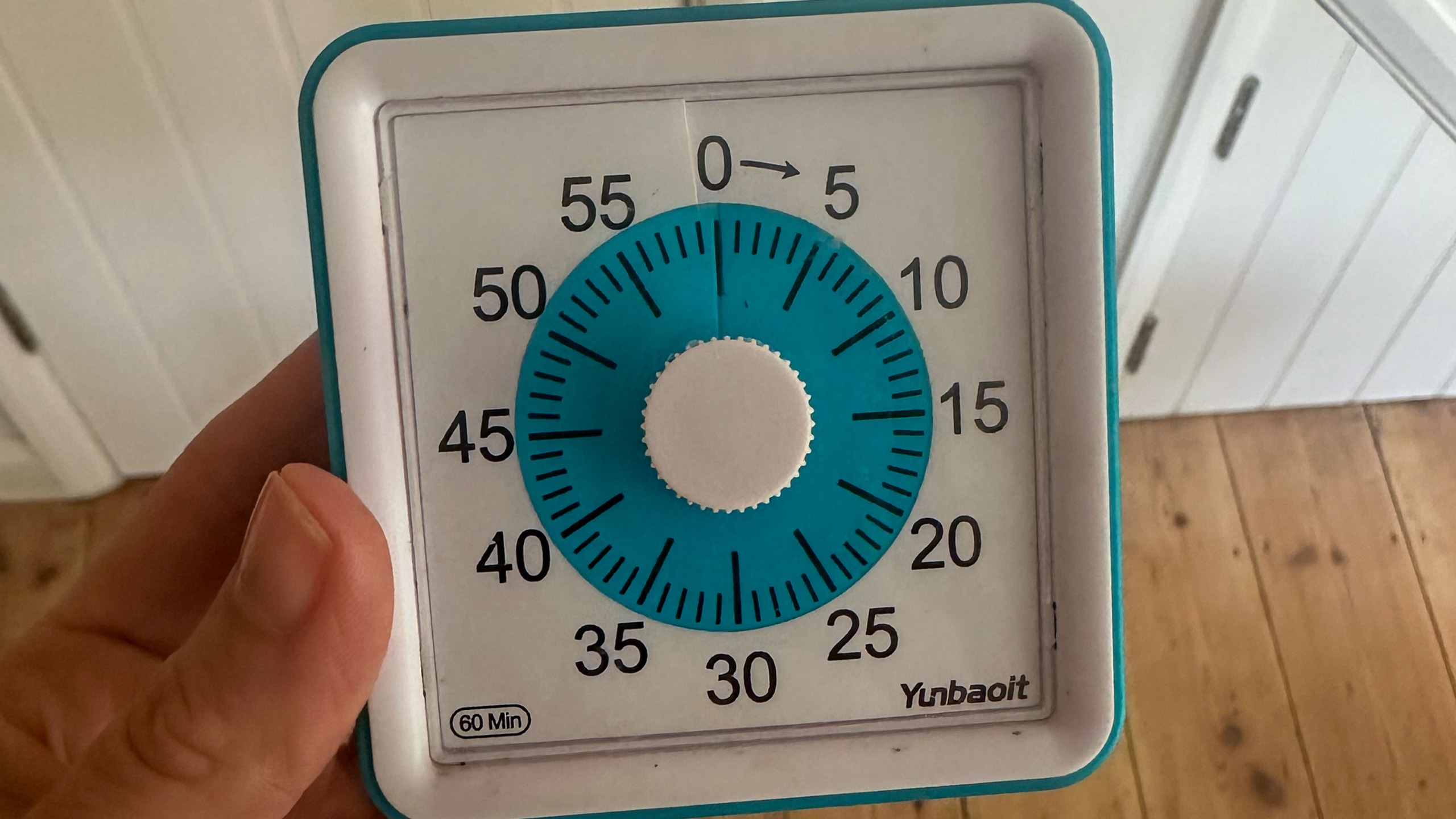 Person holding timer