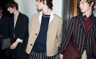 Males models wearing navy, beige and striped clothes from the Salvatore Ferragamo S/S 2018 collection