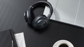 the technics eah-a800 wireless headphones in black on a desk
