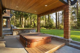 An in-ground hot tub in a contemporary garden