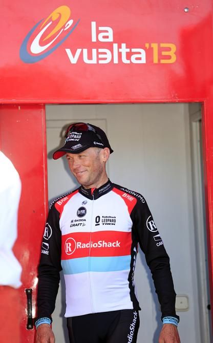 Chris Horner heads to the race leader's podium