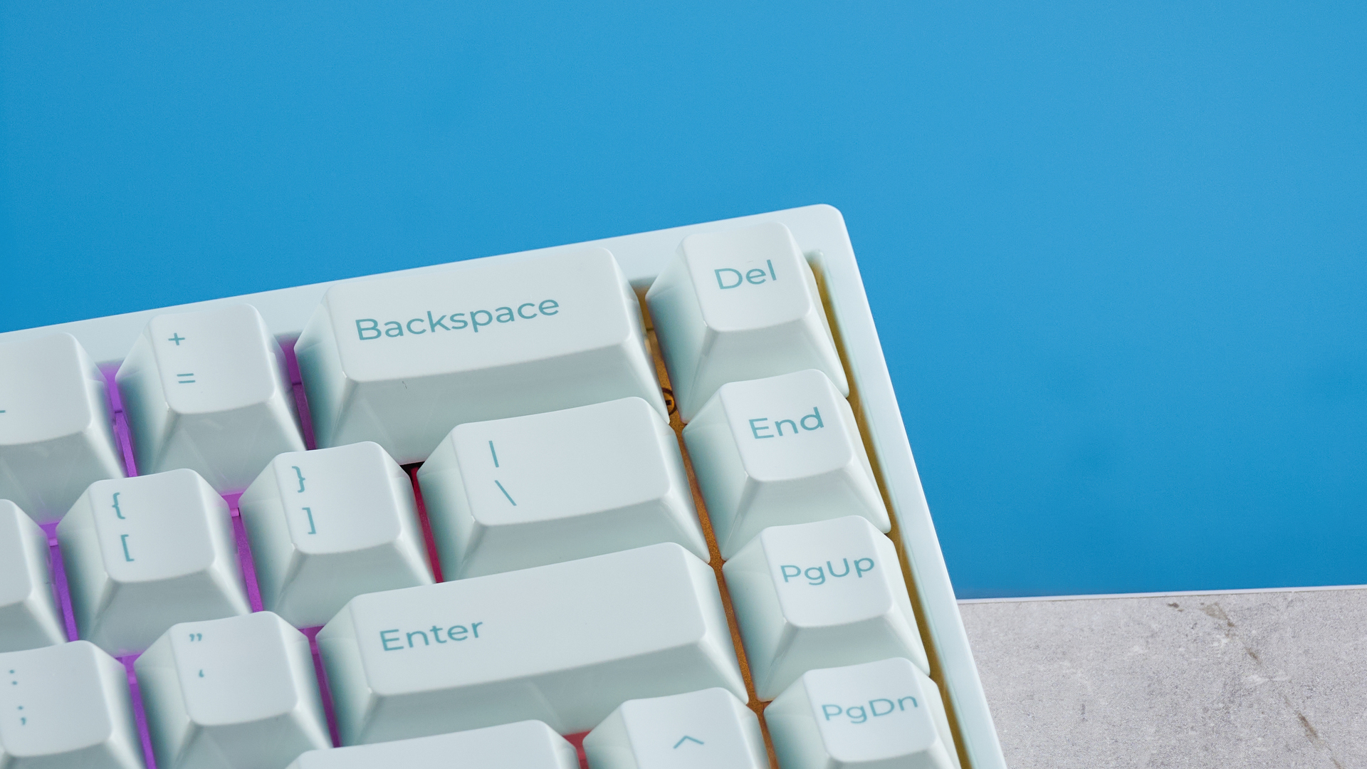 The Keychron Q16 HE 8K in light green on a stone surface