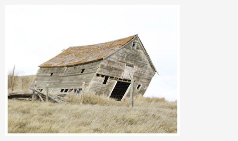 Image of a wooden barn near collapse