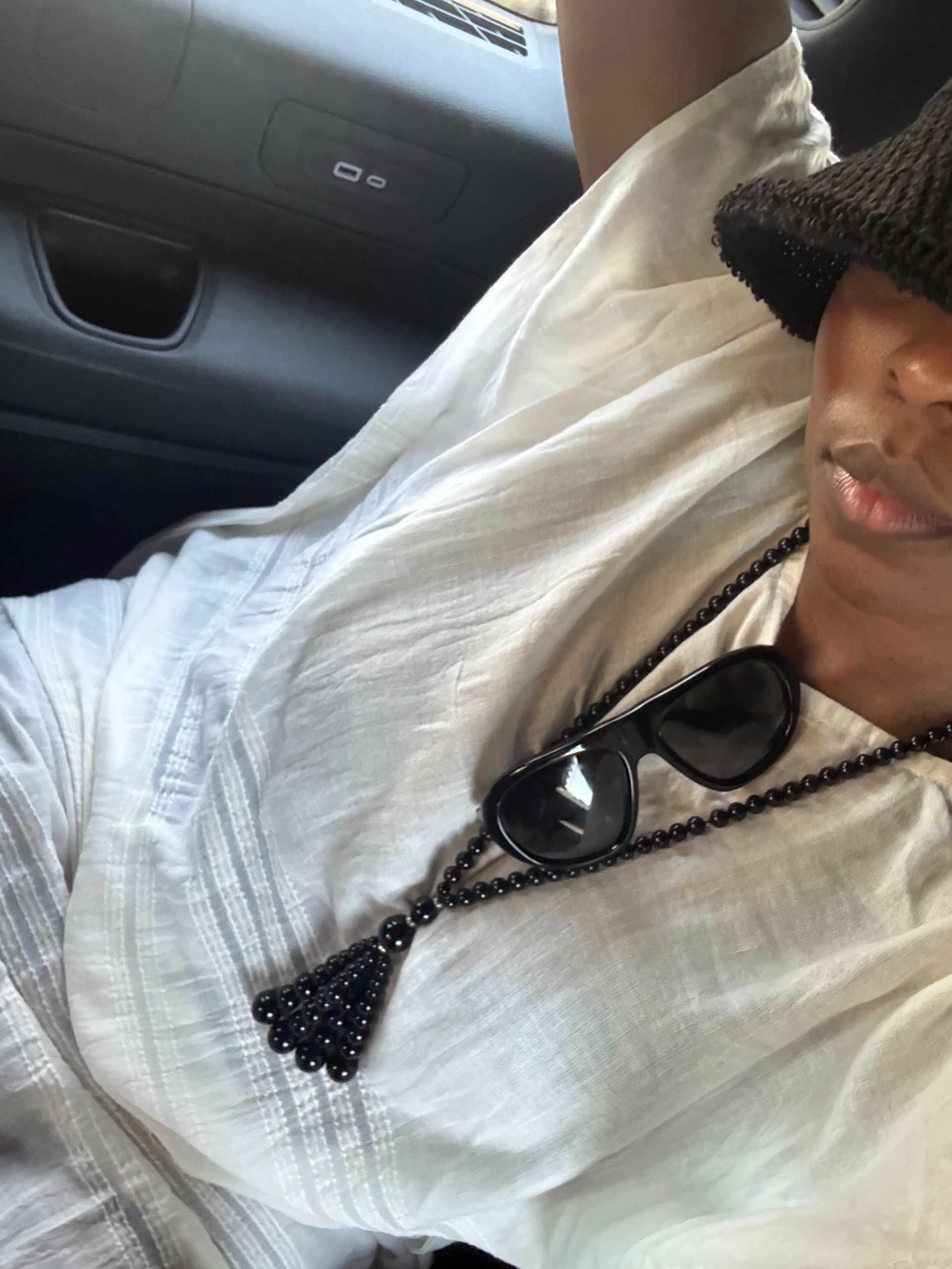 cortne bonilla wearing tasseled black necklace
